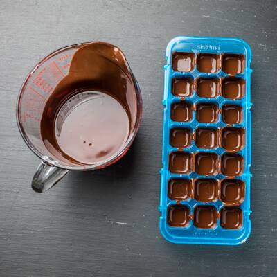 Step 3 - Melted chocolate poured into wells of tray
